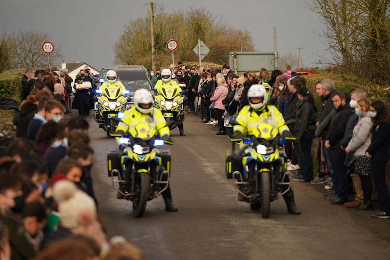 Garda outriders escort the hearse as it arrives at St Brigid's Church, Mountbolus, Co Offaly, for the funeral of Ashling Murphy. Picture by Niall Carson/PA Wire&nbsp;