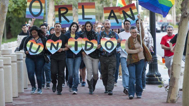 Several hundred supporters marched to Sasscer Park after a vigil at Calle Cuatro Plaza in support of the Orlando shooting victims. 