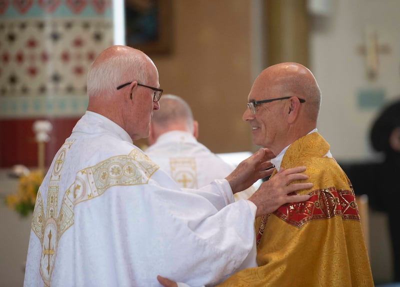 Fr Robert McMahon (right) during his ordination. Picture by Mark Marlow.