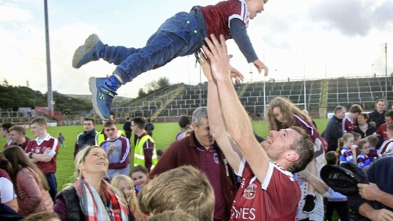 Slaughtneil&#39;s Francis McEldowney celebrates with son Barry after the 2017 Derry SFC final. The moves by Derry CCC this week have been a dramatic step in redressing the club-county balance. Picture by Margaret McLaughlin. 