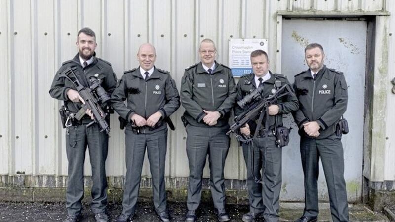 The controversial photograph of Simon Byrne posing with armed PSNI officers in Crossmaglen. Picture from Simon Byrne/ Twitter 