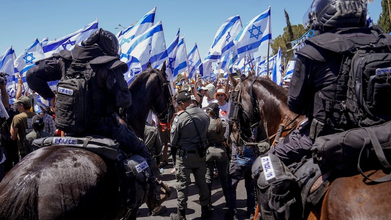 Israeli police disperse demonstrators blocking the road leading to the Knesset – Israel’s parliament (Mahmoud Illean/AP)