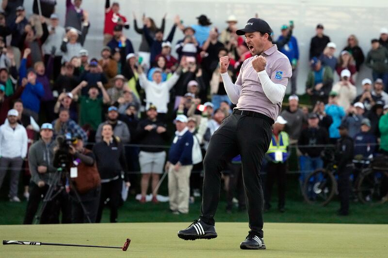 Nick Taylor celebrates after beating Charley Hoffman in a play-off at the WM Phoenix Open (Ross D. Franklin/AP)