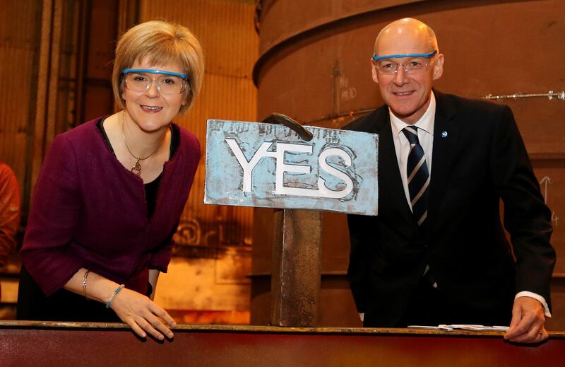 Mr Swinney and Nicola Sturgeon pose with a Yes sign ahead of the 2014 Scottish independence referendum