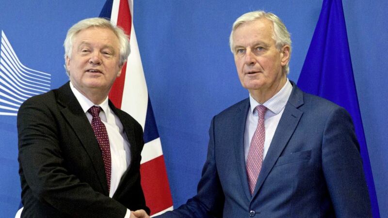 EU chief Brexit negotiator Michel Barnier, right, shakes hands with British Brexit Secretary David Davis prior to a meeting at EU headquarters in Brussels yesterday 