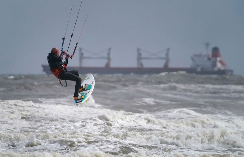 But it wasn't all bad - these kite surfers took full advantage of the stormy conditions last week