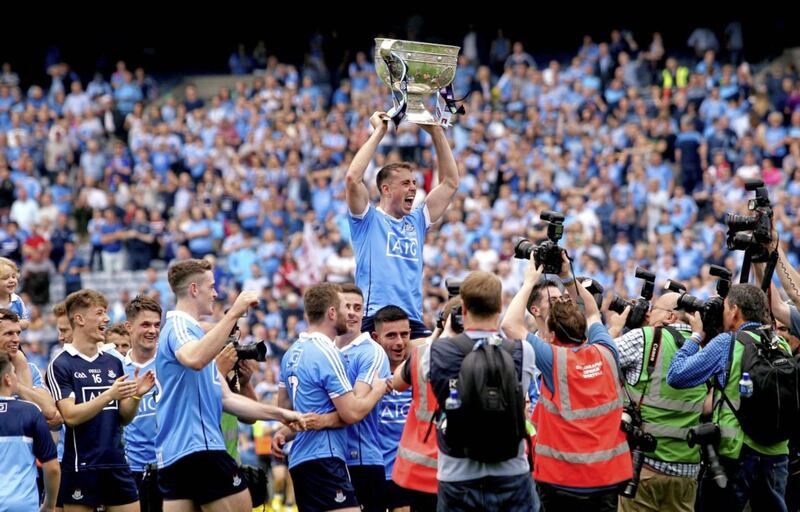 Dublin's Cormac Costello   holds up the Sam Maguire Cup after yesterday's win over Tyrone in Croke Park. Picture by Seamus Loughran