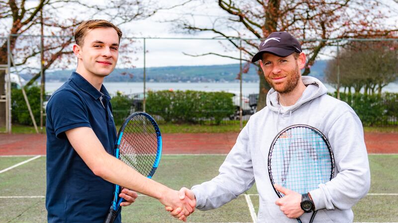 Peter Gault and Anthony Sinclair renewing friendship during an Easter tennis camps for deaf and hearing kids in Co Down