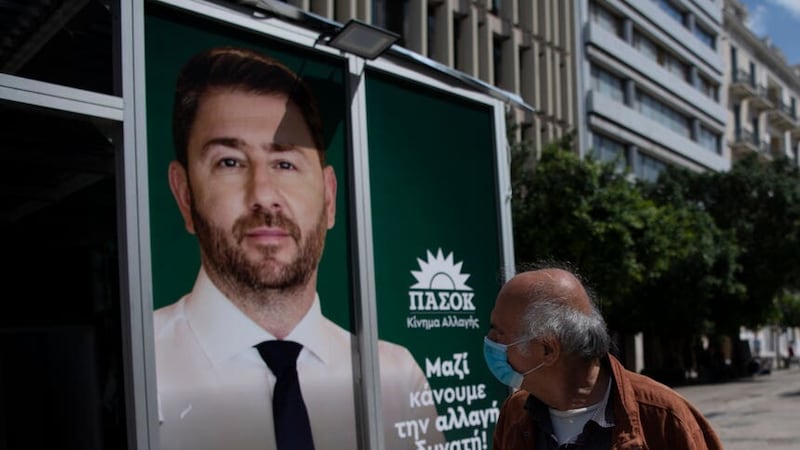 A man looks at the Pasok political party’s election kiosk in Athens (Michael Varaklas, AP)
