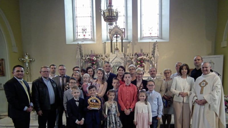 First Holy Communion in Pomeroy, Co Tyrone saw a large number of Poles travel to celebrate the sacrament with relatives. Pictured on the far left is St Mary&#39;s PS principal Damian Eannetta and on the right, parish priest Fr David Moore and P4 teacher Anne-Marie Devlin 