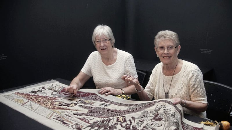 Peggy Hagan, from Bangor, and Valerie Wilson of the Ulster Museum, two of the women who are embroidering the Game Of Thrones tapestry, on display at the Belfast museum Picture: Ann McManus 