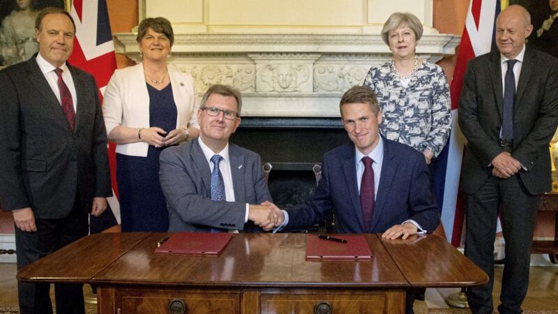 Sir Jeffrey Donaldson signs June&#39;s confidence and supply deal with Tory chief whip Gavin Williamson inside 10 Downing Street. Picture by Daniel Leal-Olivas/PA Wire 