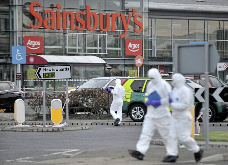 Police flood the area around the Sainsbury&#39;s car park in Bangor, Co Down following the shooting of a Colin Horner in front of horrified shoppers on Sunday. 