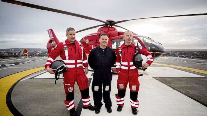 (left to right) Clinical lead Darren Monaghan, pilot Rich Steele and operational lead Glenn O&#39;Rorke of the NI HEMS on the helipad at the Royal Victoria Hospital. Picture by Liam McBurney/PA Wire 