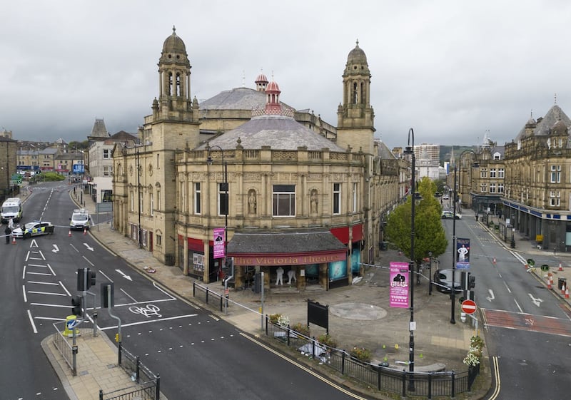 Police activity outside the Victoria Theatre in Fountain Street, near to the scene of a triple stabbing in Commercial Street in Halifax, West Yorkshire