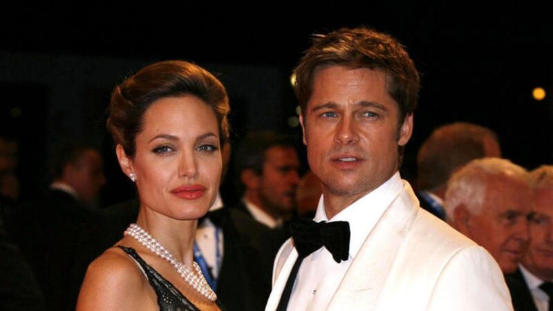 Brad Pitt and his wife Angelina Jolie in 2007, as the FBI is considering an investigation into an alleged altercation between Pitt and one of his children on a private plane. Picture by Yui Mok, Press Association