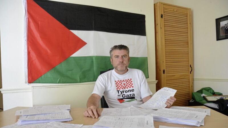 Palestinian campaigner John Hurson with a petition signed by several high-profile GAA members 