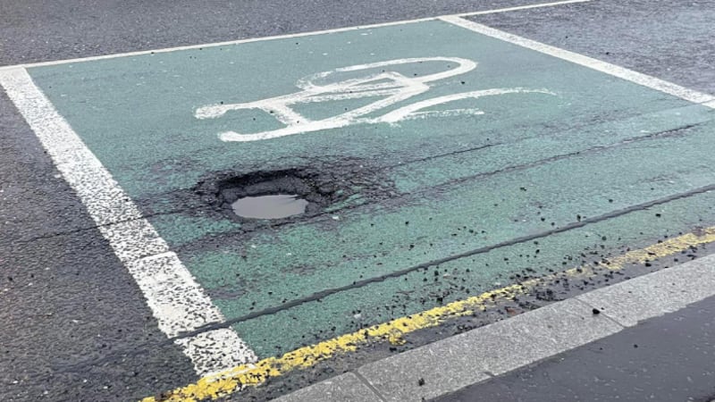 A pothole in a road