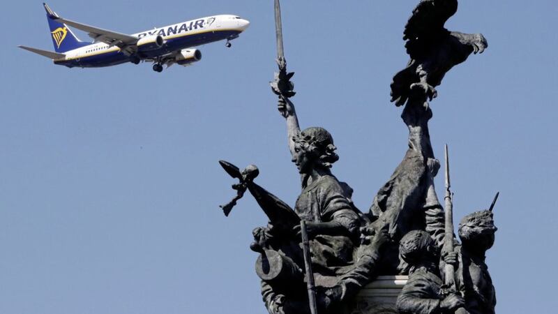 A Ryanair airplane approaching for landing at Lisbon airport flies past the Monument to the Heroes of the Peninsular War, in the foreground Picture by Armando Franca/AP 
