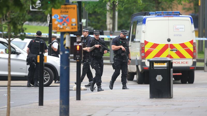 Armed police outside the National Football Museum, close to the Manchester Arena, the morning after a suicide bomber killed 22 people, including children, as an explosion tore through fans leaving a pop concert in Manchester&nbsp;