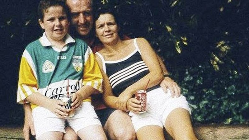 Shane Lowry as a child pictured in an Offaly jersey with his parents. 