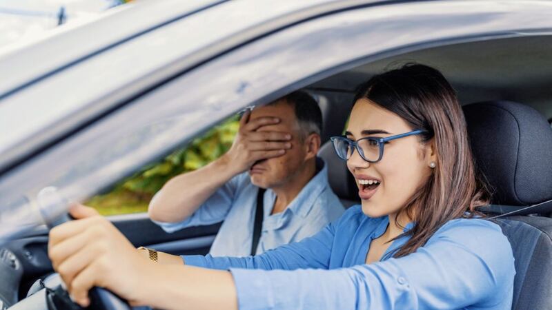 Pretending you have a passenger in the rear seat can help keep dad driving lessons good-natured 