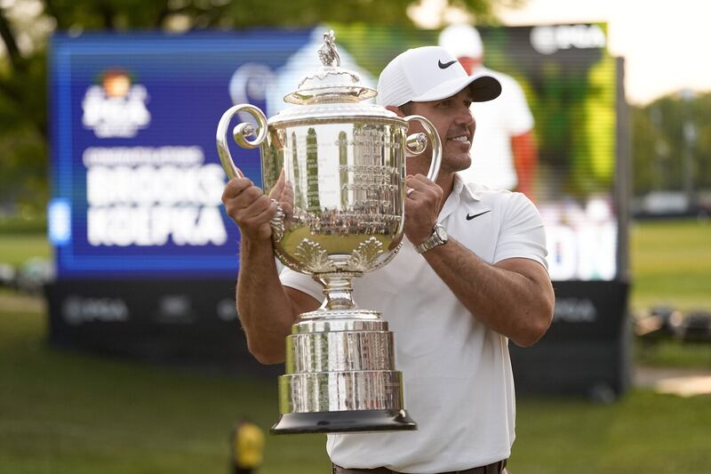 Brooks Koepka gets his hands on the Wanamaker Trophy for the third time after his victory at Oak Hill in May   Picture by AP