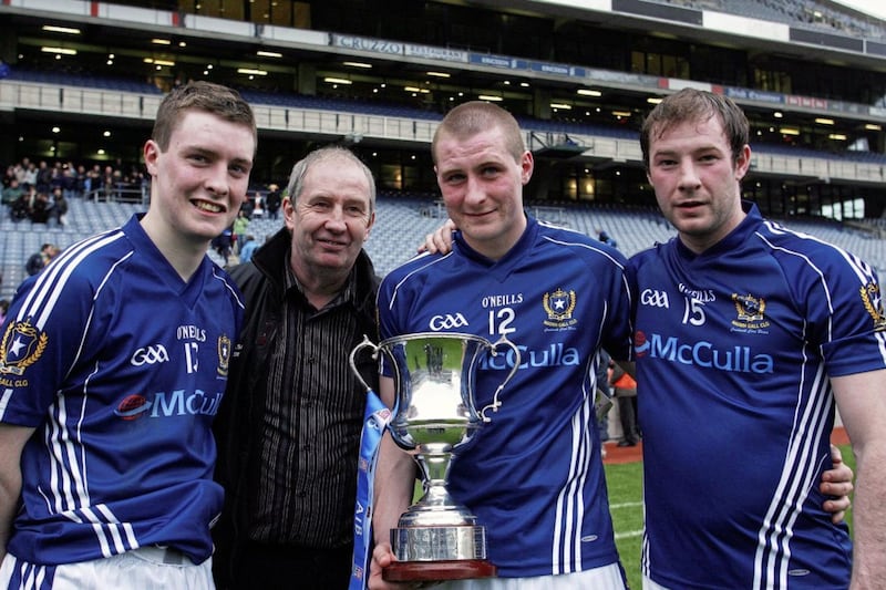 CJ McGourty with his father Sean, and brothers Kevin and Kieran after their All-Ireland Club final win in 2010 Picture: Seamus Loughran 