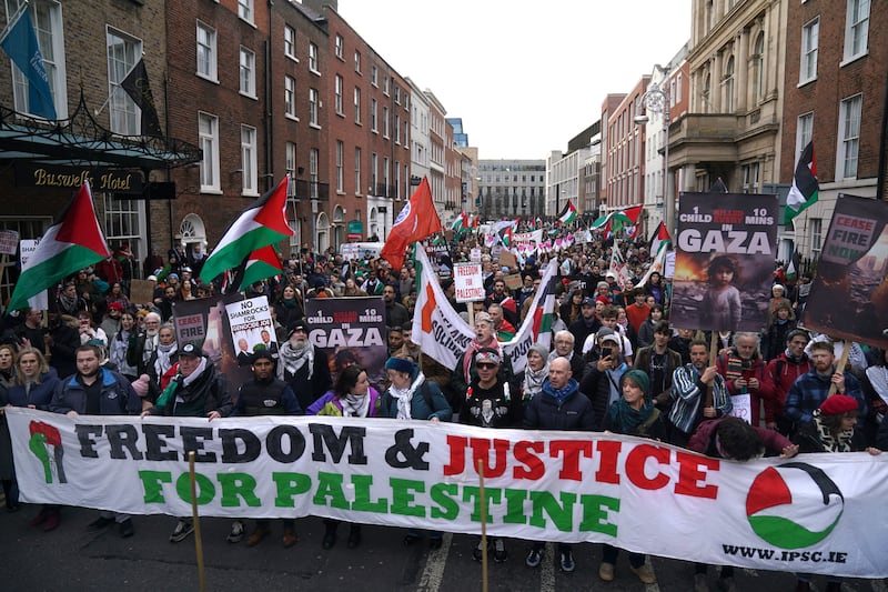 People marched in Dublin city centre during a pro-Palestinian march to the Oireachtas parliament .