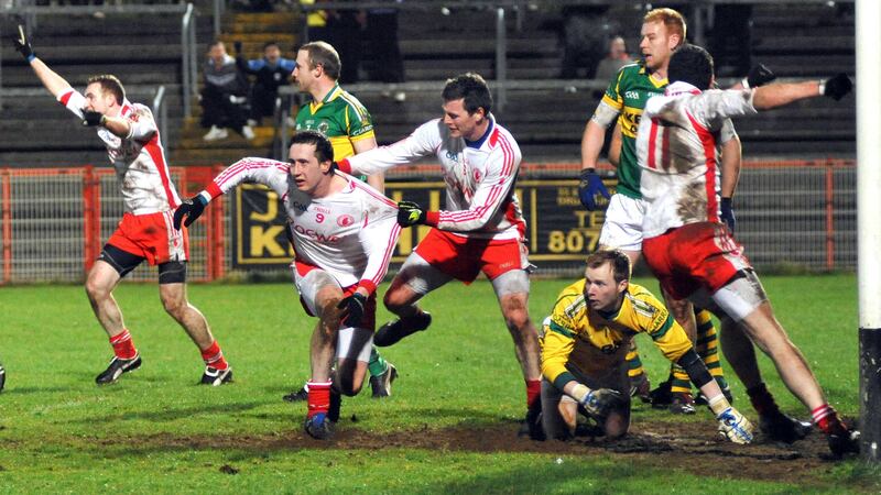 On this day March 27 2010 - Colm Cavanagh is ushered to his feet by an exuberant Conor Gormley after Colm fisted the ball into the Kerry goal in the final seconds of the Division One match at Healy Park