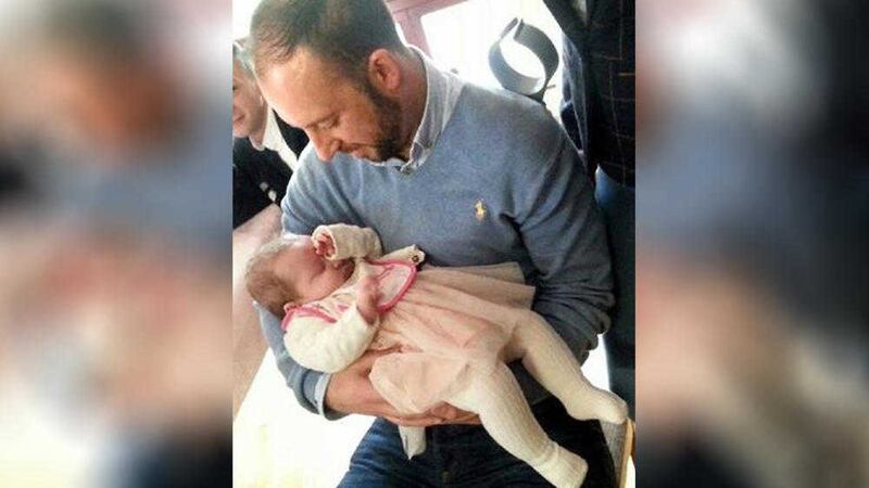 Davitt Walsh cradling four-month-old Rioghnach-Ann McGrotty 