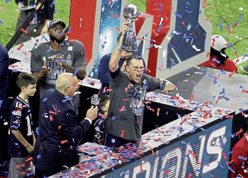 New England Patriots&#39; Tom Brady celebrates with the Vince Lombardi Trophy after winning the NFL Super Bowl 51 football game against the Atlanta Falcons, Sunday, Feb. 5, 2017, in Houston. (AP Photo/Charlie Riedel). 