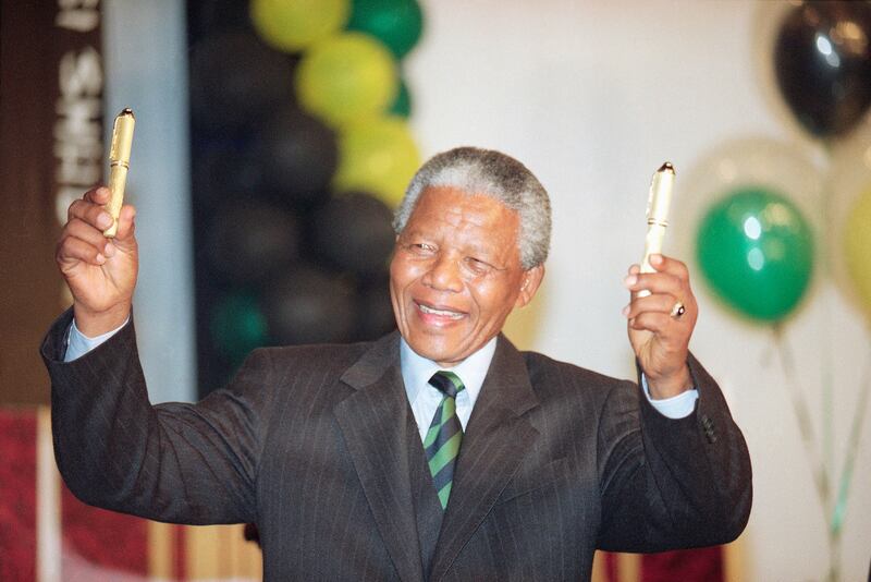The planned auction of dozens of artefacts belonging to Nelson Mandela, pictured in 1994, has been suspended pending a court application to completely halt it (John Parkin/AP)