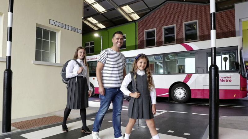 Campaign ambassador and Cool FM breakfast show presenter Pete Snodden with pupils Layla and Hannah Tilson from Whitehead at the launch of RADAR&rsquo;s Back to School Road Safety Awareness Campaign 