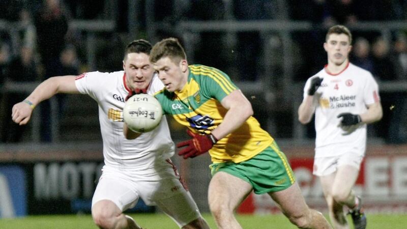 Tyrone&#39;s Peter Teague moves in to tackle Donegal&#39;s Eoghan Ban Gallagher 