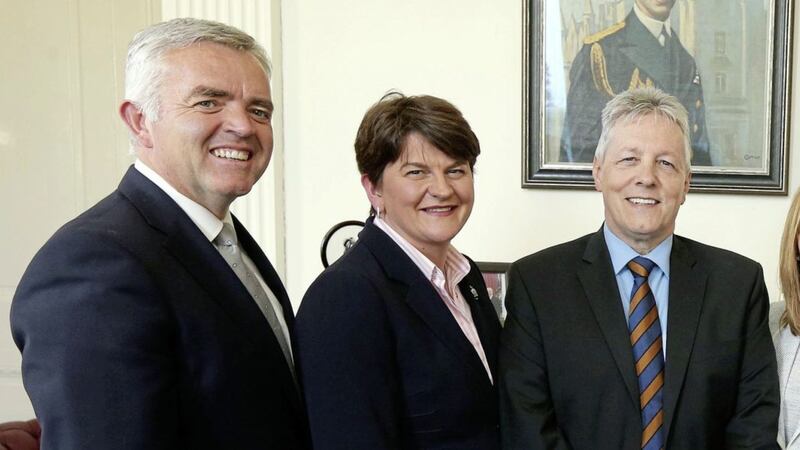 Ex-DUP minister Jonathan Bell, party leader Arlene Foster and former party leader Peter Robinson 