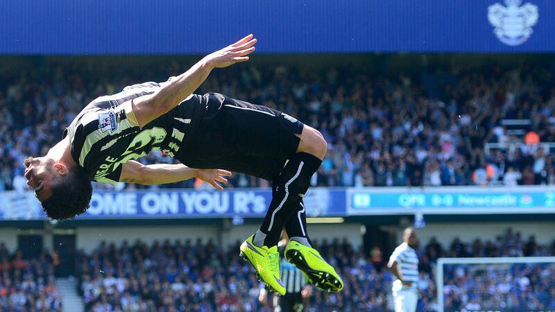Newcastle United&#39;s Emmanuel Riviere does a backflip as he celebrates scoring his side&#39;s goal at Loftus Road on Saturday Picture: PA 