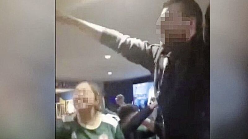 A still from the video in which people wearing Northern Ireland replica shirts are heard singing &#39;We hate Catholics&#39; 