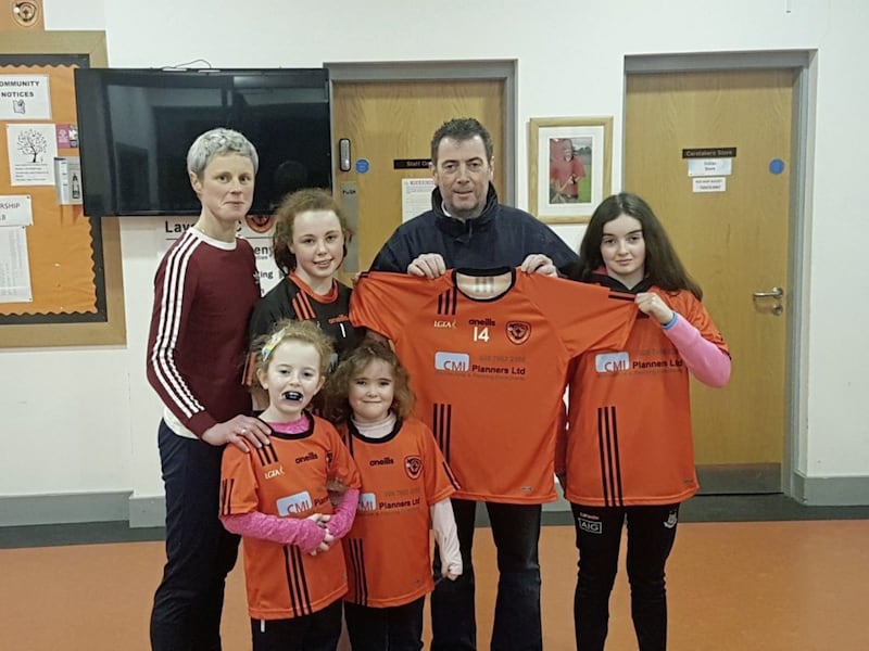 <address>Chris Cassidy of CMI Planning and his daughters hand over a new sponsored set of jerseys to the Lavey U14 girls&rsquo; football team. Included in picture are MJ Boyle (chairperson) and U14 players Mary McNally and Ellie Hendry