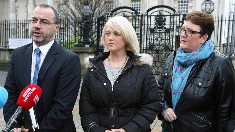  Patrick Corrigan (amnesty NI) with Sarah Ewart and Jane Christie outside the High Court in Belfast. Picture Matt Bohill.. 