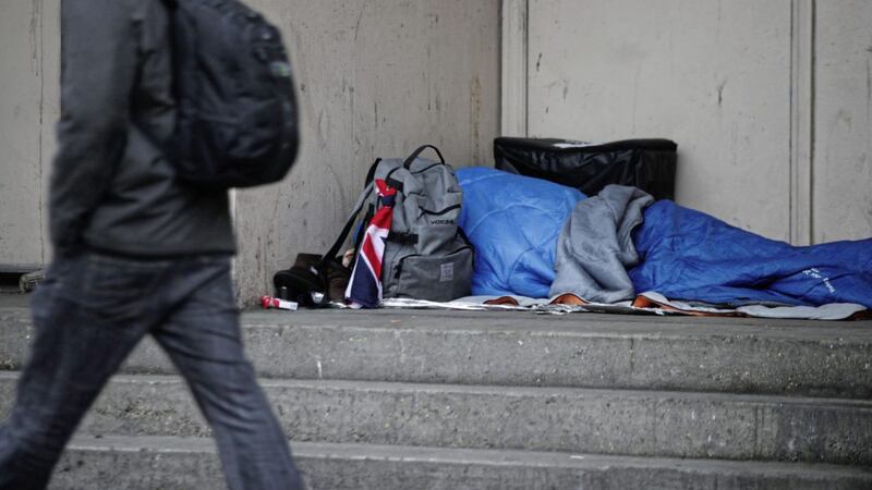 A person sleeps rough in a doorway. Picture by Yui Mok, Press Association 