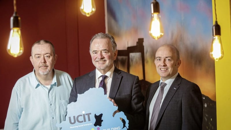  UCIT has announced a record start to 2017, paying out &pound;2m in loans to 18 projects, including East Belfast Enterprise. Pictured are Duncan Graham, East Belfast Enterprise chair, Harry McDaid, UCIT CEO and Jonathan McAlpin, East Belfast Enterprise CEO. Picture by Brian Thompson 