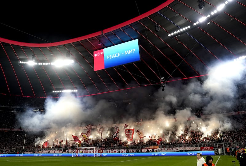 Bayern fans let off smoke flares in the stands