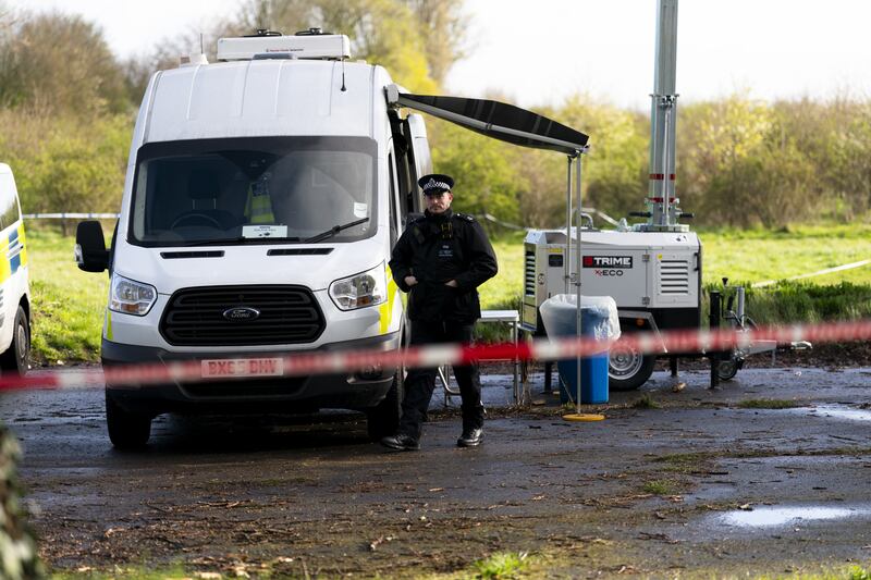 Police near the scene in Rowdown Fields, New Addington, Croydon, south London, where human remains were found