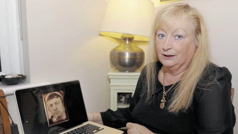 Patricia McVeigh with a picture of her father Patrick McVeigh who was shot by the MRF in May 1972 
