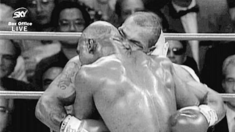 BITE NIGHT.....Mike Tyson launching his biting assault on Evander Holyfield during their World Heavyweight title clash in Las Vegas in June 1997 