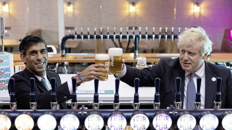 Prime Minister Boris Johnson with Chancellor of the Exchequer Prime minister Rishi Sunak with his predecessor Boris Johnson during a visit to a brewery in London in 2021. 