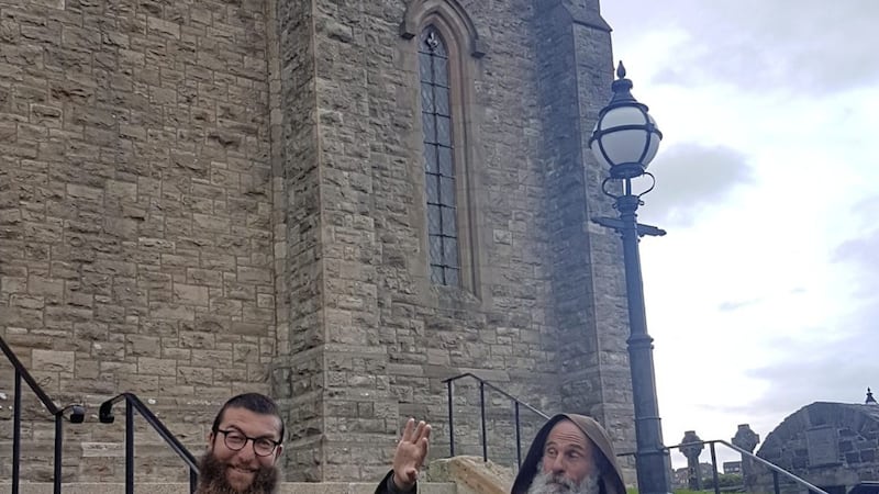 Brother David, pictured left, and Brother Biagio of the Mission of Hope and Charity outside St Patrick&#39;s Church, Downpatrick. The two monks, from Sicily, are travelling across Europe on foot. 