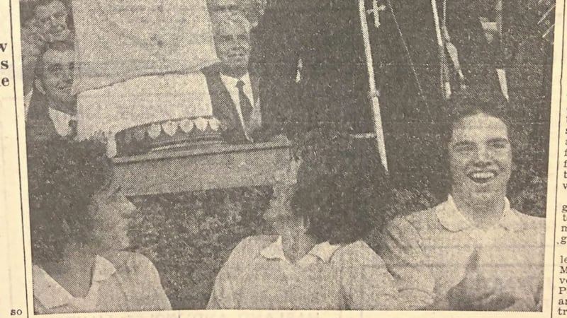 Tyrone Minor captain Des McKenna lifts the Tom Markham Cup in 1973. 