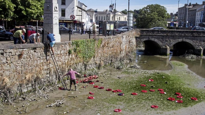 Local people took it on themselves to  retrieve wreaths thrown into the Clanrye River during a previous attack in July this year. Picture by Newraypics.com